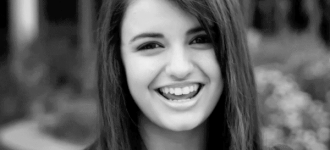 Rebecca Black signs record deal, Friday video gets 1 million dislikes